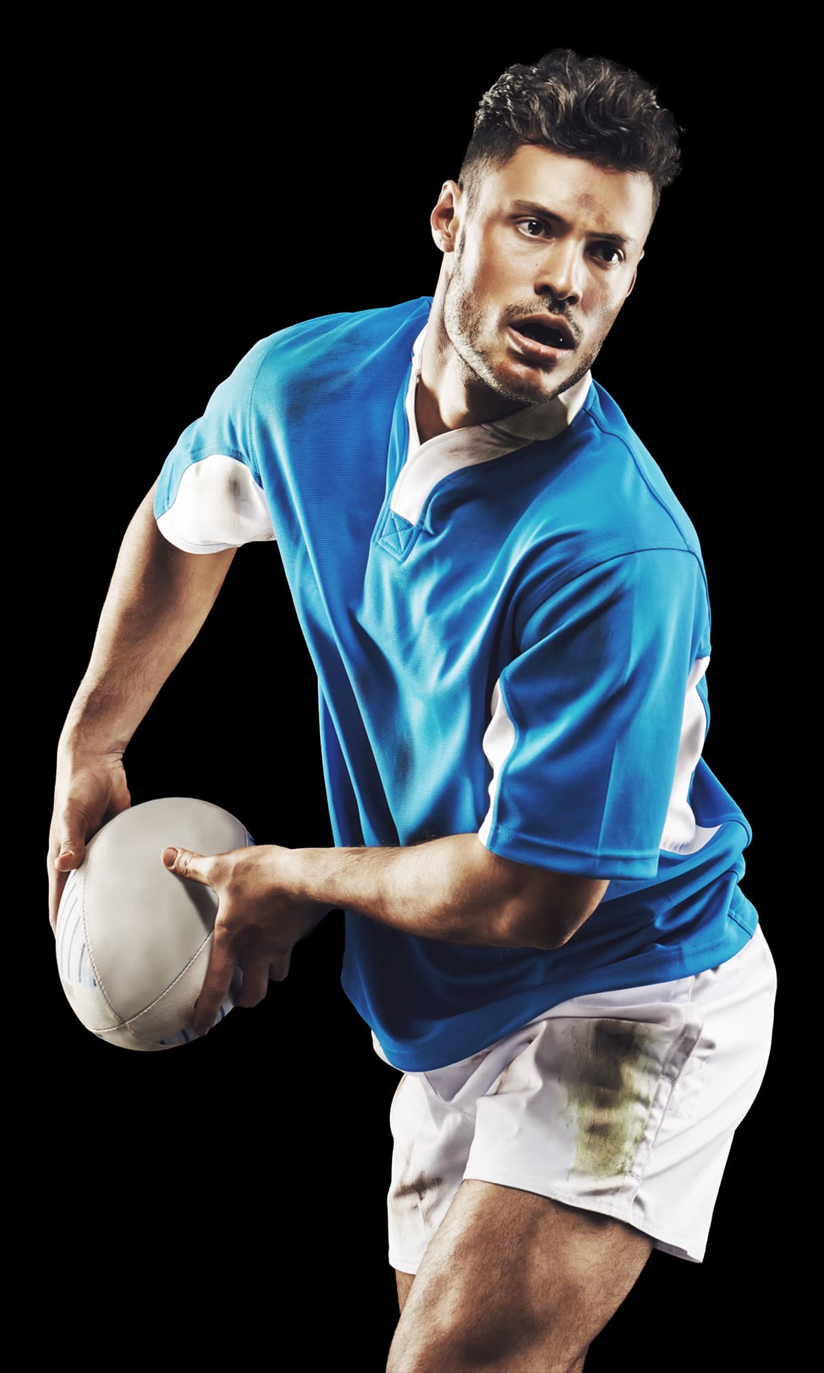Rugby player in team kit holding a rugby ball
